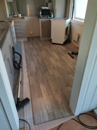Nytt gulv etter vannskade på kjøkken